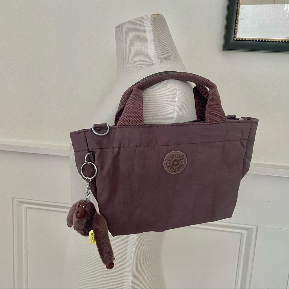 Kipling Dusty Rose Handbag with Nanny Monkey. Never used 12” W x 7 “H x 6” D.